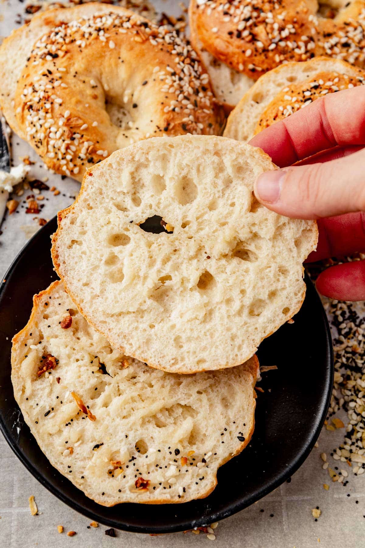 high protein cottage cheese bagel cut in half on a plate