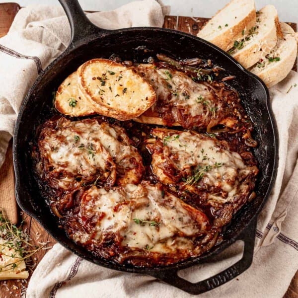 french onion chicken bake in a cast iron skillet